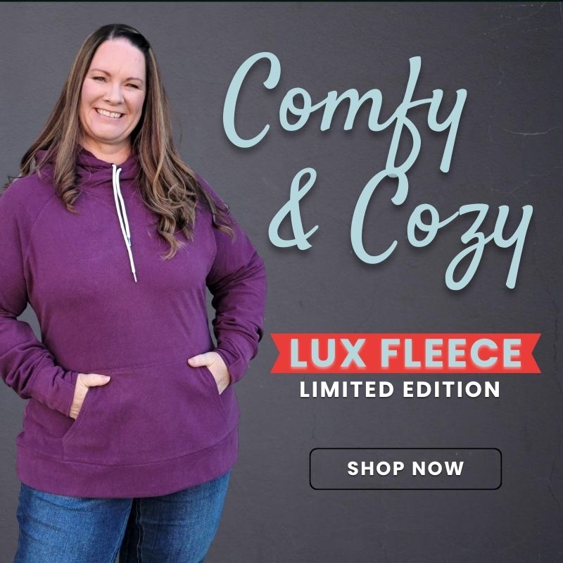 Showcasing our New fleece hoodie shown in berry on a women in 3x