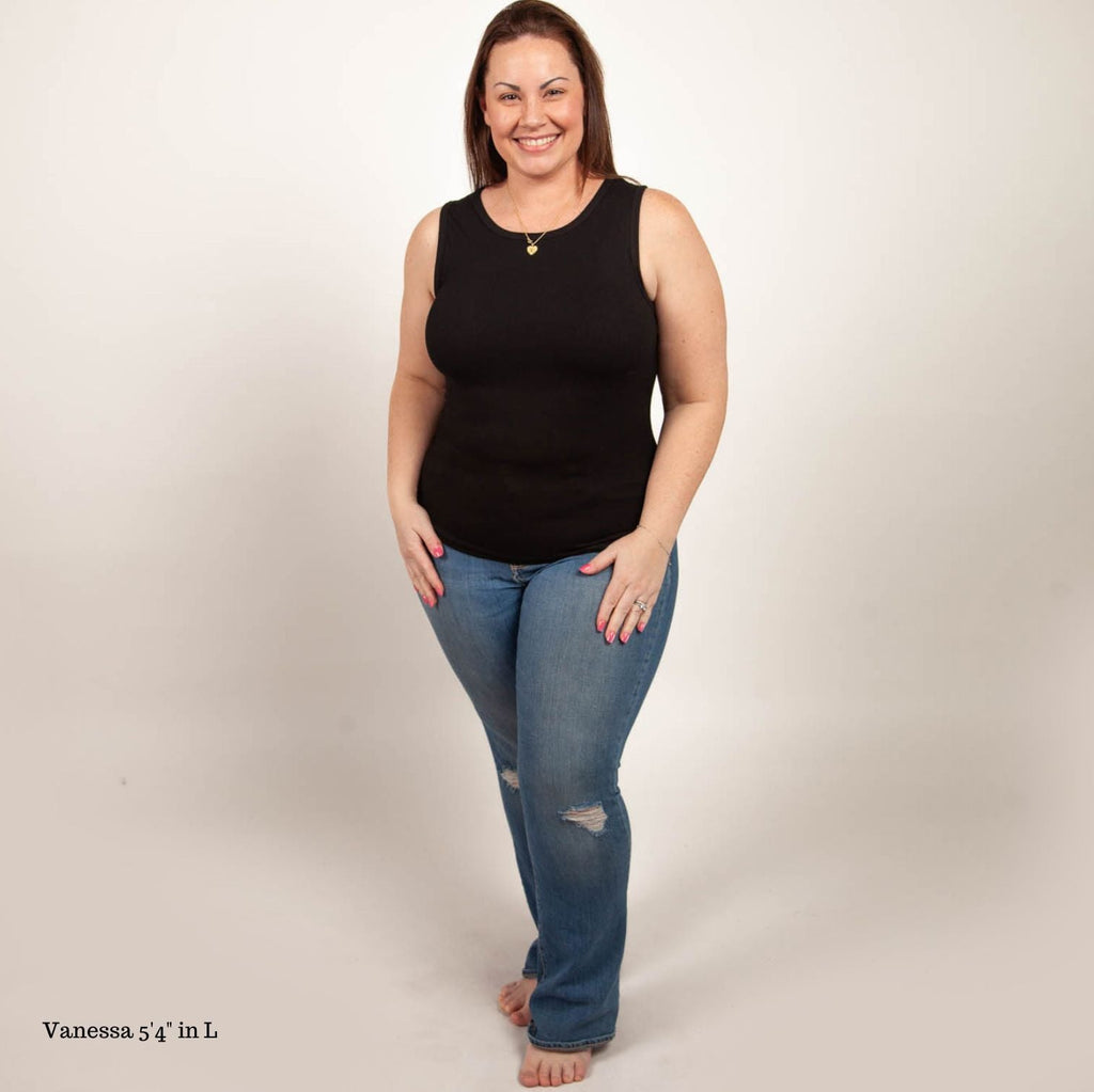 A woman wearing a black high-neck ribbed tank top. shown in size large