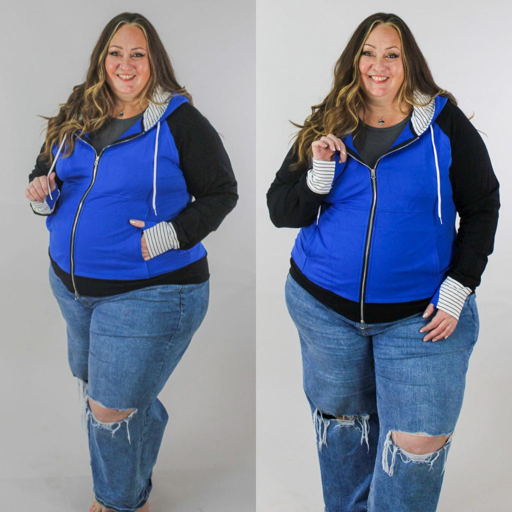 Woman wearing a blue and black hoodie with a white and black pinstripe lined hood with thumbholes and full double zipper.  features watch cuff. shown in size 3XL