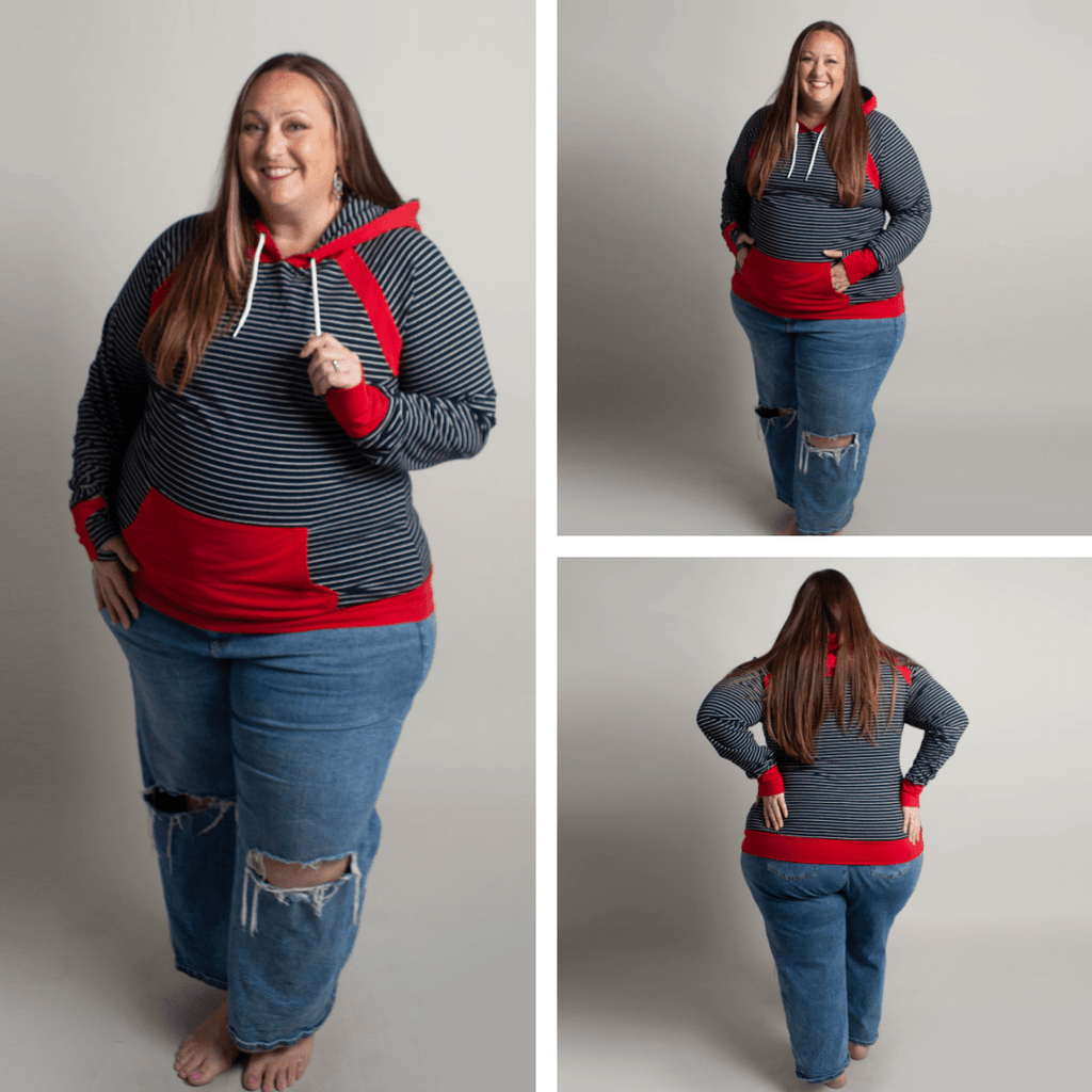 Woman wearing a blue and white striped hoodie with red accents, kangaroo pocket, and thumbholes. shown in size 3XL