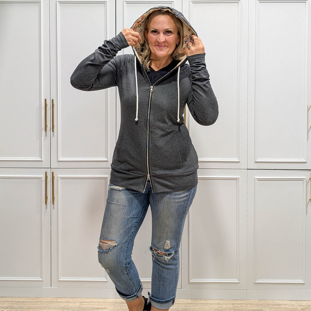 Meadow Fullzip - Women's fashion hoodie color block grey body with cream floral print accented hood and thumbholes. Features double zipper for curvier fit, feminine tailored, side pockets, and hood shown in M women