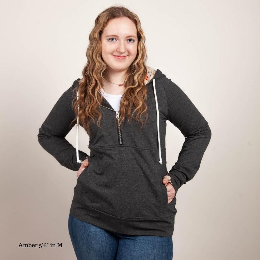 Meadow Half Zip Womens Hoodie, Floral accents, Grey half zip hoodie, longer body, longer sleeves with comfortable thumbholes, deep lined hood, shown in size Medium- Shop7degrees