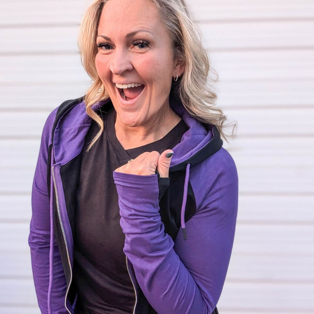 Raven Fullzip - Women's fashion hoodie color block Black body with dark purple accented sleeves with black in the thumbholes and black on the outside of hood and purple in hood. Features double zipper for curvier fit, feminine tailored and hood shown in M women