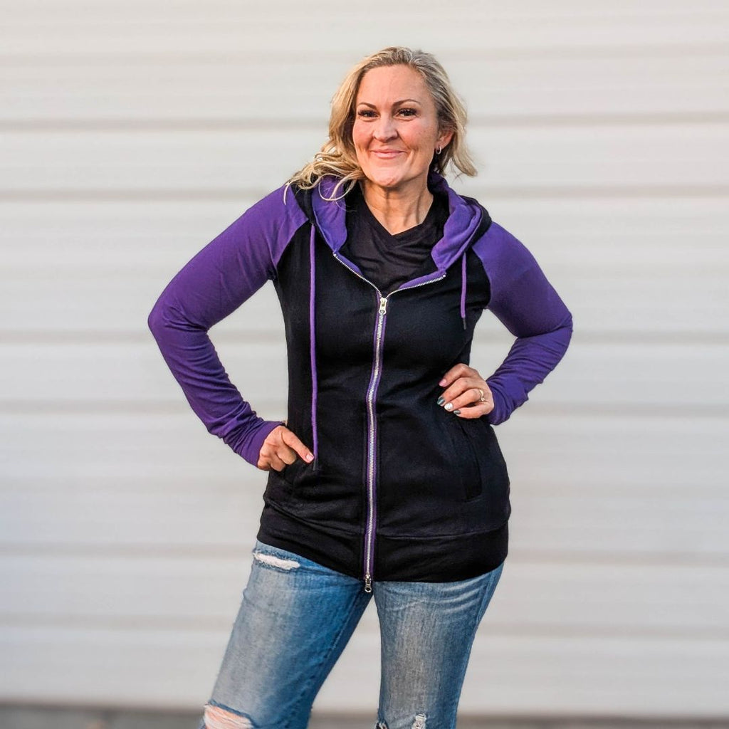 Raven Fullzip - Women's fashion hoodie color block Black body with dark purple accented sleeves with black in the thumbholes and black on the outside of hood and purple in hood. Features double zipper for curvier fit, feminine tailored and hood shown in M women