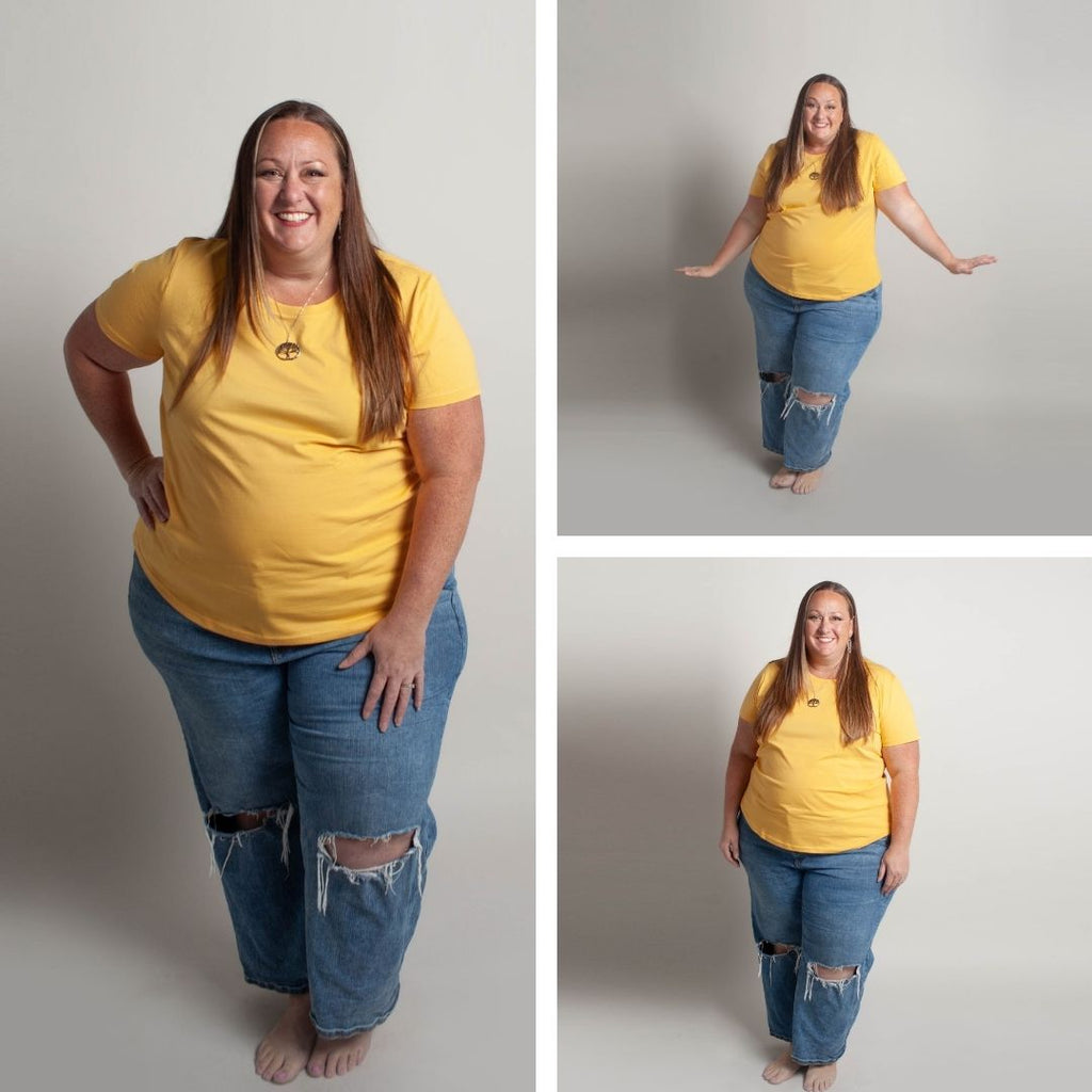 Woman wearing a sunset yellow crew neck shirt. shown in size 3XL