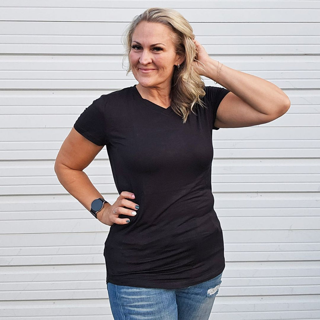 V - Neck Black T-shirt - women's semi-fitted short sleeve shirt for feminine tailored look. long torso with longer back, soft lightweight stretchy fabric for comfort. solid black color shown in size medium women