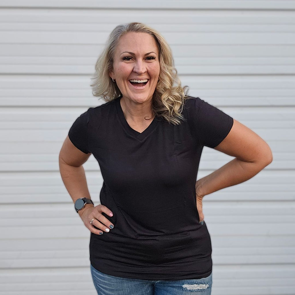 V - Neck Black T-shirt - women's semi-fitted short sleeve shirt for feminine tailored look. long torso with longer back, soft lightweight stretchy fabric for comfort. solid black color shown in size medium women