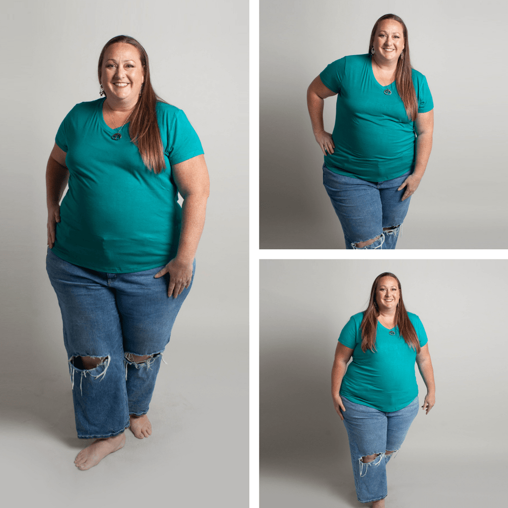 Woman wearing a teal micro ribbed v-neck semi-fitted, longer length shirt. shown in size 3XL