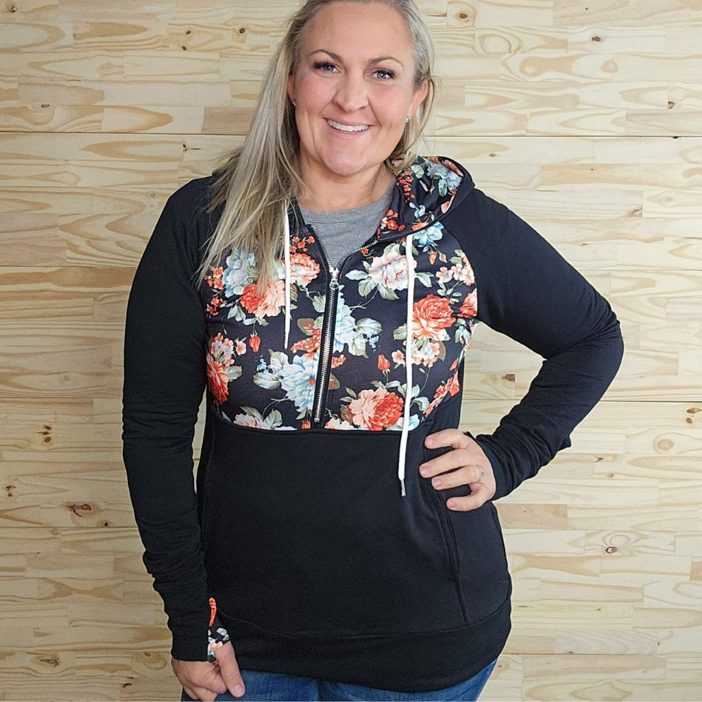 Bliss Half Zip, Black and floral half zip hoodie with thumbholes, oversized hood, hourglass shape, shown in size Large - Shop7degrees