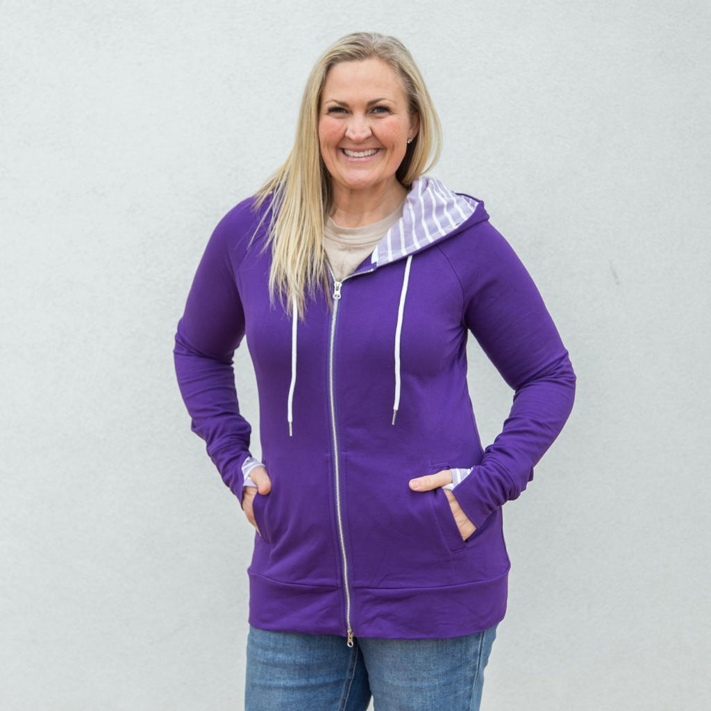 Holly Full Zip, purple with lavender and white accented hood and thumbholes, shown in size large, hourglass shape, double zipper, inside pockets - Shop7degrees