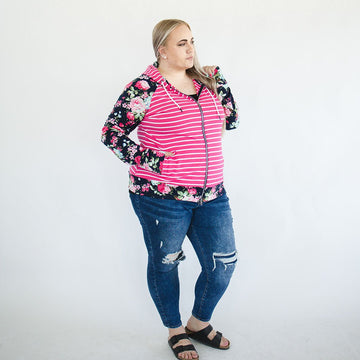 plus size shown on women in 2x Izzy Full Zip Womens fashion hoodie deep hood, fushia pink and white strip with blue floral sleeves and accented thumbholes and hood  - Shop7degrees