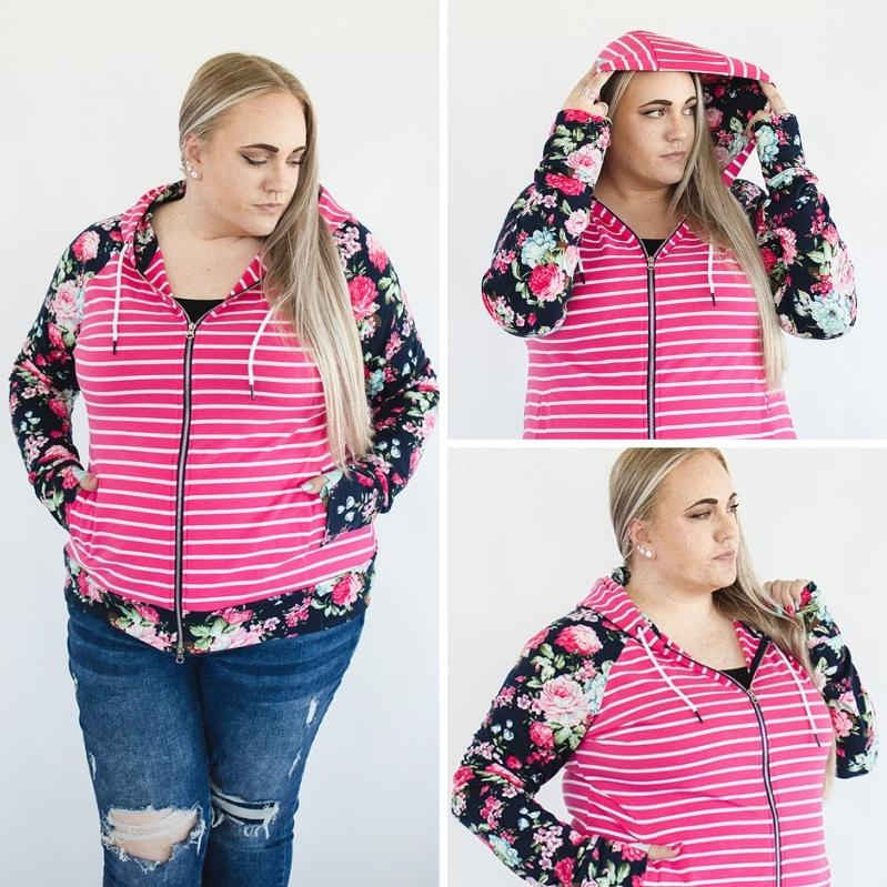 Gallery view womans fashion hoodie plus size trendy hoodie double zipper shown in 2x Izzy Full Zip Womens fashion hoodie deep hood, fushia pink and white strip with blue floral sleeves and accented thumbholes and hood - Shop7degrees