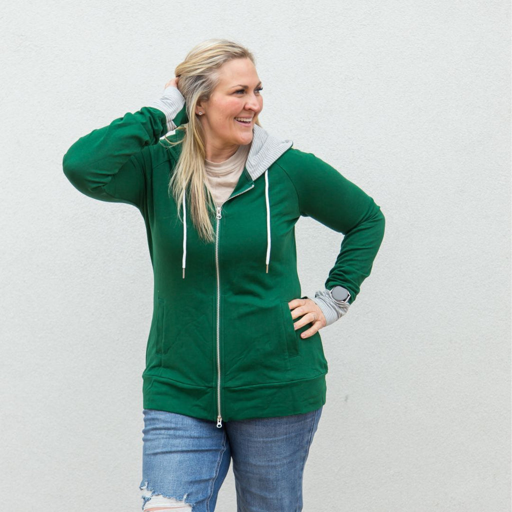 Jennifer Full Zip, forest green with grey accent hood and thumbholes, shown in size large, hourglass shape - Shop7degrees