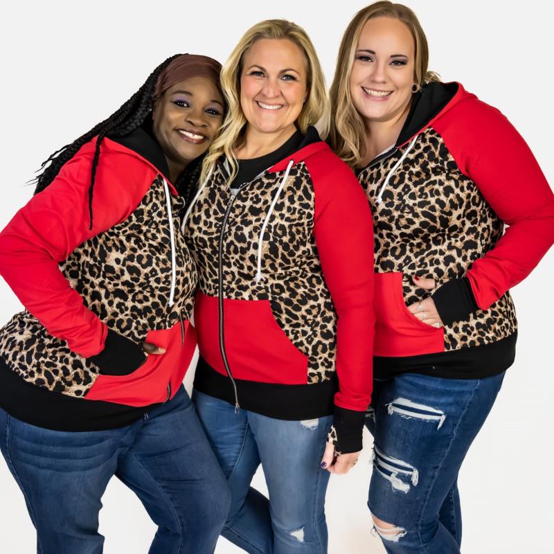 Leopard Love womens Full Zip hoodie, leopard print and red long sleeves with thumbholes and black accents- Shown in 1X, Large and 2X, womens plus size clothing, size inclusive 7degrees