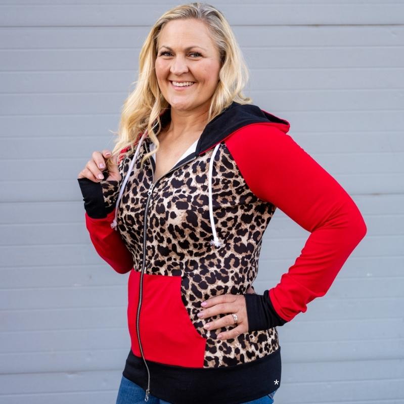 Leopard Love womens Full Zip hoodie, leopard print and red long sleeves with thumbholes and black accents, casual womens fashion- Shown in size large 7degrees