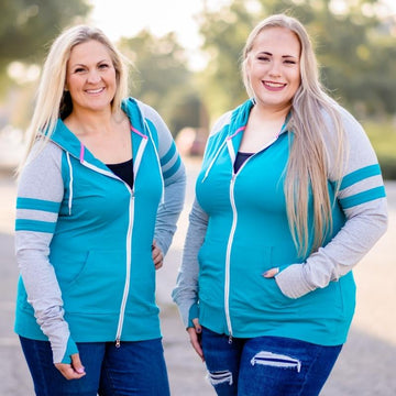 Mirage Full Zip Hoodie, womens full zip hoodie, plus size, inclusive sizing, Turquoise body with grey sleeves, longer body, longer sleeves with thumbholes, double zipper, shown in size Large and 2X- Shop7degrees