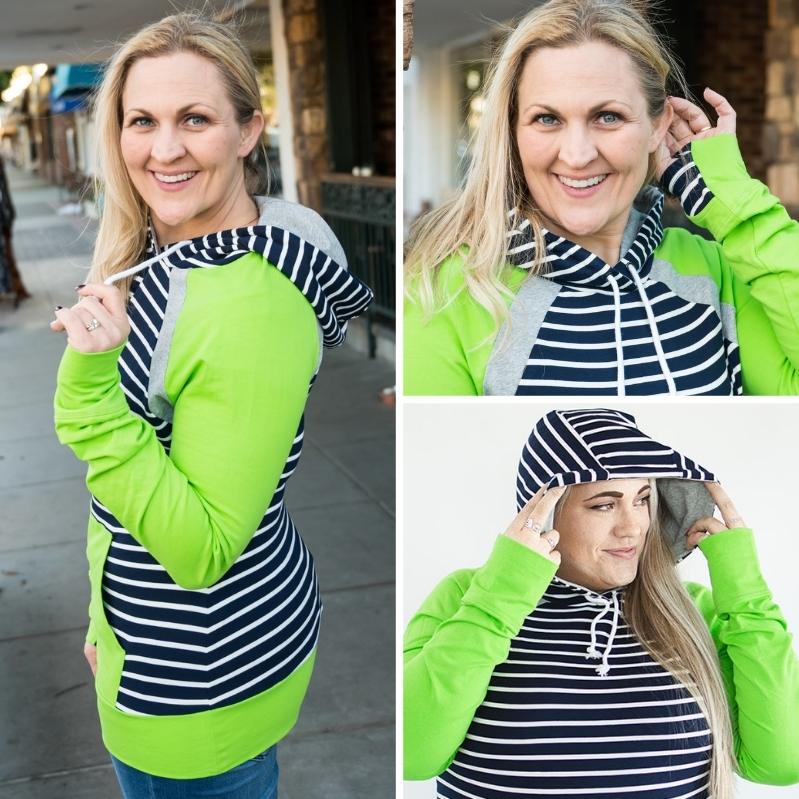 Gallery detail view Seattle Pullover, bright green womens pullover hoodie, dark blue and white stripe accents, longer body, extra large hood, longer sleeves with comfortable thumbholes, kangaroo pocket 7degrees