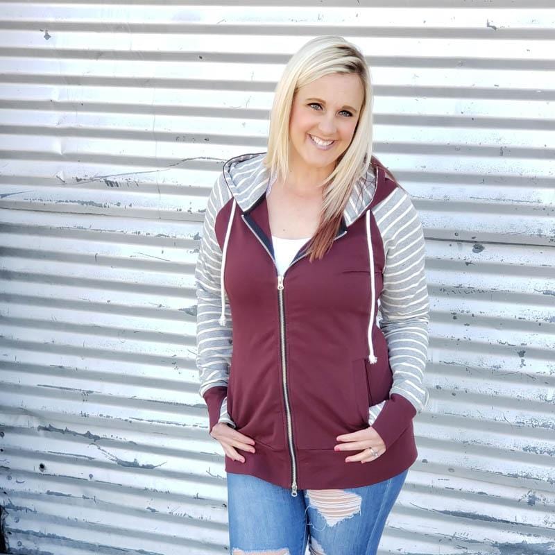 Varsity Full Zip Woman's Hoodie, maroon body with grey and white striped long sleeves, double zipper hoodie, long sleeve with thumbholes, womens clothing shown in size large - Shop7degrees